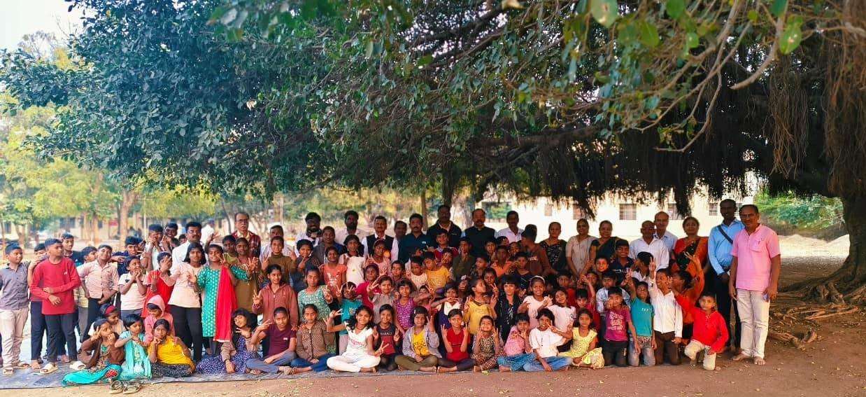 Group of attendees participating in plantation activities outdoors